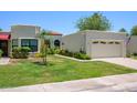 Charming single-story home with a well-maintained lawn, attached garage, and neutral stucco exterior at 7635 S Taylor Dr, Tempe, AZ 85284