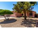 A well-maintained single-Gathering home featuring desert landscaping and mature trees at 11338 E Contessa St, Mesa, AZ 85207