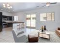 Bright living room boasts white tile, neutral paint, and modern furniture at 1367 S Country Club S Dr # 1125, Mesa, AZ 85210
