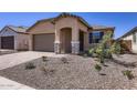 Lovely home with low-maintenance landscaping and a welcoming covered entryway at 15600 W Williams St, Goodyear, AZ 85338
