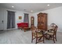 Inviting living room featuring neutral walls, wood-look floors, and plenty of space for relaxing and entertaining at 1799 N 209Th Ave, Buckeye, AZ 85396