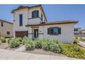 Charming two-story home features desert landscaping and a welcoming front entrance at 2540 N 148Th Dr, Goodyear, AZ 85395