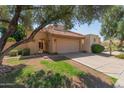 Inviting single-Gathering home with desert landscaping, tile roof, and attached garage at 2635 N El Dorado Pl, Chandler, AZ 85224