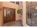 Charming front entryway with decorative door and hanging planter at 2635 N El Dorado Pl, Chandler, AZ 85224