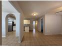 Bright living room with tile flooring, neutral paint and an open layout at 2745 E Wood St, Phoenix, AZ 85040