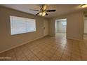 View of the living room from the Kitchen showing the main entry and bright natural light at 2745 E Wood St, Phoenix, AZ 85040