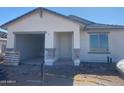 New construction, single story home featuring a covered front entrance and an attached garage at 32016 N Pony Express Rd, San Tan Valley, AZ 85143