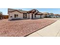 Charming home featuring a well-maintained exterior with a two-car garage and low-maintenance landscaping at 3408 N 69Th Dr, Phoenix, AZ 85033