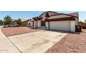 Charming home featuring a well-maintained exterior with a two-car garage and low-maintenance landscaping at 3408 N 69Th Dr, Phoenix, AZ 85033