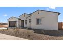 Beautiful single-story home featuring desert landscaping, and a convenient two-car garage at 37695 W Santa Maria St, Maricopa, AZ 85138