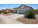 A single-story house featuring a two-car garage and desert landscaping at 4231 E Augusta Ave, Chandler, AZ 85249