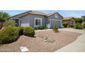 Single-story home with a two-car garage and gravel landscaping at 4231 E Augusta Ave, Chandler, AZ 85249