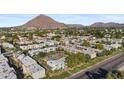 Aerial view of a multi-Gathering dwelling featuring a pool and mountain views at 4610 N 68 N St # 476, Scottsdale, AZ 85251