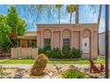 Attractive single-story residence showcasing stucco walls, desert landscaping, and decorative facade elements at 509 N Hobson Plz, Mesa, AZ 85203