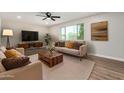 Inviting living room with ample seating, warm wood accents, and a large window at 556 S Forest --, Mesa, AZ 85204