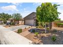 Well maintained single-story home with desert landscaping and a paved walkway at 838 W Basswood Ave, Queen Creek, AZ 85140