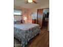 Charming main bedroom featuring a comfortable bed, calming decor, and an en-suite bathroom at 8600 E Broadway Rd # 91, Mesa, AZ 85208