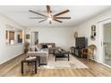 Comfortable living room featuring a large sectional sofa, ceiling fan, and open design at 903 W Shawnee Dr, Chandler, AZ 85225