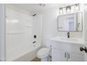 Clean bathroom features modern fixtures, a shower-tub combo, and vanity with quartz countertop at 948 S Alma School Rd # 1, Mesa, AZ 85210