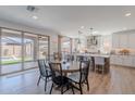 Open-concept kitchen featuring granite countertops, stainless steel appliances, and a seamless connection to the outdoor at 9645 E Ripple Dr, Mesa, AZ 85212