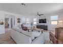 Inviting living room featuring a comfortable sofa, wood floors, and plenty of natural light at 9645 E Ripple Dr, Mesa, AZ 85212