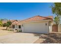Charming single-story home with a well-manicured yard and a neutral color palette at 10155 E Wood Dr, Scottsdale, AZ 85260