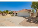 Charming single-story home with a well-manicured yard and a neutral color palette at 10155 E Wood Dr, Scottsdale, AZ 85260