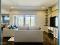 Beautiful living room with outdoor access and hardwood floors throughout at 10572 E Autumn Sage Dr, Scottsdale, AZ 85255