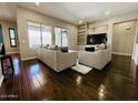 Bright living room with hardwood floors and plush seating and lots of light at 10572 E Autumn Sage Dr, Scottsdale, AZ 85255