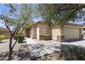 Charming home featuring stone accents, desert landscaping, and a well-manicured front yard at 12732 S 175Th Dr, Goodyear, AZ 85338