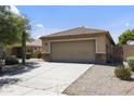 A well-maintained single-story home featuring a two-car garage and desert landscaping at 12732 S 175Th Dr, Goodyear, AZ 85338