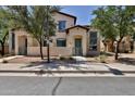 Charming two-story home featuring neutral stucco, a gated entry, and drought-tolerant landscaping at 14870 W Encanto Blvd # 1038, Goodyear, AZ 85395