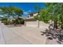 Well-maintained two-story home featuring a three-car garage and manicured landscaping at 15411 S 13Th Ave, Phoenix, AZ 85045