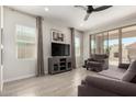 Cozy living room with tile floors, neutral colors, and lots of natural light at 19751 W Adams St, Buckeye, AZ 85326