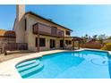 Inviting backyard pool with patio, balcony, and lush landscaping perfect for outdoor enjoyment at 2050 W Nido Ave, Mesa, AZ 85202