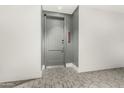 Condo front door showing unit number 3004 and neutral carpet flooring at 3131 N Central Ave # 3004, Phoenix, AZ 85012