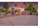 Inviting home featuring a well-manicured lawn, desert landscaping, and an attached two-car garage at 3204 N Jay St, Chandler, AZ 85225