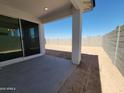 Covered patio offers shade and outdoor living space, with a view of the block-walled backyard at 3510 N Camden Dr, Florence, AZ 85132