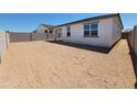 Expansive dirt backyard enclosed by a block wall, perfect for customization and landscaping opportunities at 3510 N Camden Dr, Florence, AZ 85132