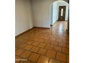 Inviting room with eye-catching tile flooring, arched doorway, and natural light streaming through the entrance at 3734 W Dailey St, Phoenix, AZ 85053