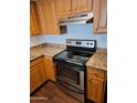 A close up of the stainless steel oven and laminate countertops in the kitchen at 3810 N Maryvale Pkwy # 2077, Phoenix, AZ 85031