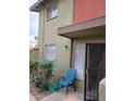 Exterior showcasing a secure gated entry to the property, enhanced by a cozy outdoor sitting area at 4615 N 39Th Ave # 21, Phoenix, AZ 85019