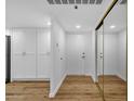 Bright entryway featuring a coat closet, and wood-look flooring at 7920 E Camelback Rd # 104, Scottsdale, AZ 85251