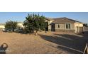 Charming single-story home with low maintenance desert landscaping and beautiful curb appeal at 9759 E Brown Rd, Mesa, AZ 85207