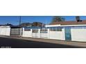 Gated home has concrete fencing for privacy and security at 1226 W Purdue Ave, Phoenix, AZ 85021