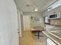 Cozy kitchenette features a breakfast table and classic tile flooring at 1226 W Purdue Ave, Phoenix, AZ 85021