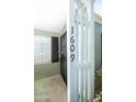Close-up of the front door area displaying the house number and security gate at 1609 W Lewis Ave, Phoenix, AZ 85007