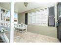 Relaxing front porch with bench, offering a cozy outdoor seating area at 1609 W Lewis Ave, Phoenix, AZ 85007