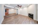 Bright living room with hardwood floors, fireplace, and recessed lighting at 1820 E Morten Ave # 119, Phoenix, AZ 85020