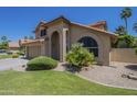 Charming two-story home featuring a well-manicured lawn, a two car garage and a terra cotta roof at 2340 W Myrtle Dr, Chandler, AZ 85248